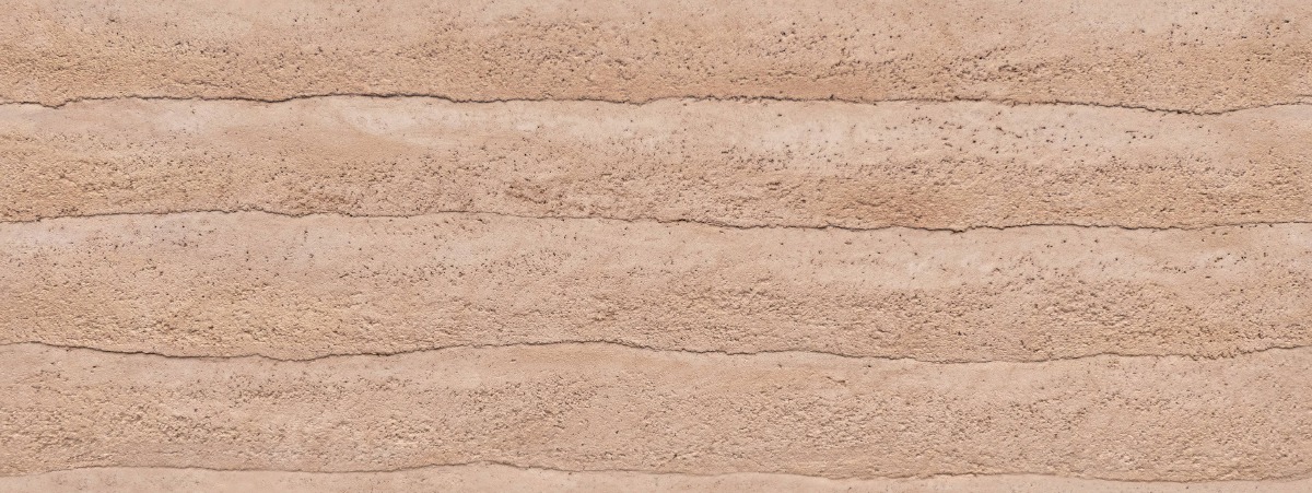 A seamless finishes texture with rammed earth - tropical sand units arranged in a None pattern
